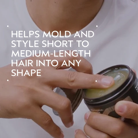 Image 2 - A persons hands are shown, with one finger dipping into an open black jar of light-colored hair styling product, and white text on the image reads HELPS MOLD AND STYLE SHORT TO MEDIUM-LENGTH HAIR INTO ANY SHAPE. Image 3 - The image shows a before and after comparison of a persons dark, wavy hair from behind, with the hair on the left, labeled BEFORE, appearing messy and unwashed, and the hair on the right, labeled AFTER, looking smoother, more defined, and hydrated, with the text Unwashed Hair below the before image, and Results with scalp solutions exfoliating scalp treatment, balancing shampoo, hydrating scalp & hair masque, refreshing protective mist, overnight repair serum. Styled with aveda men pure-formance™ pomade, texture tonic, light elements defining whip, and air control™ light hold hair spray. below the after image. Image 4 - A man with dark, wavy hair is shown in a circular frame on a dark green background, adjusting his hair, with the text HOW TO USE, FINISH WITH STYLE, and After using your favorite aveda shampoo and conditioner, use Aveda Men Pure-formance TM Pomade to add control and shine to your look. Image 5 - A translucent, yellowish cosmetic gel or balm swatch with ridges and texture on a plain white background. Image 6 - A dark green background features a circular insert showing green, wavy plant-like structures submerged in blue-green water with bubbles, accompanied by the white text Formulated Without Animal Derived Ingredients, Mineral Oil, SLS, SLES, Synthetic Fragrance, Parabens, Phthalates, Petrolatum, Paraffin, & Formaldehyde Donors. Image 7 - The image displays three white logos against a background of dark green leaves: the 100% Vegan logo, the Certified B Corporation logo, and the Leaping Bunny Cruelty Free International logo.