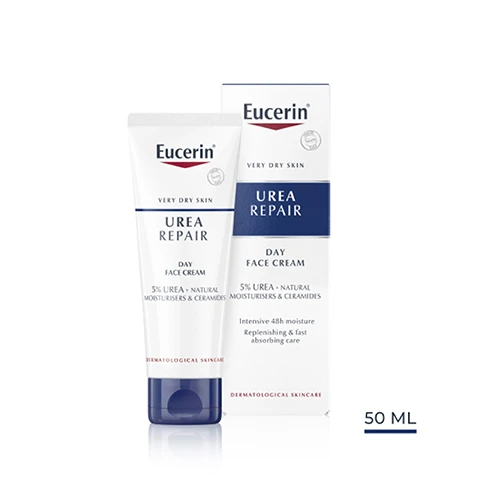 Image 1 - A tube of Eucerin Urea Repair Day Face Cream for very dry skin is shown, alongside its box, featuring visible text including 5% UREA, natural moisturisers and ceramides, and dermatological skincare, along with a label reading 50 ML.
Image 2 - A woman applying cream to her cheek is featured alongside text that lists the key benefits: Intensive 48h moisture, Fast absorbing, Replenishing basic care.
Image 3 - A hand holding a tube of Eucerin Urea Repair cream is displayed on the left, and on the right, text reads Dry, tense, dehydrated skin, For face, and Day along with an icon of a sun.
Image 4 - A smooth, white cream with labels indicating its ingredients: 5% Urea, Ceramides, and Natural Moisturisers.
Image 5 - Image shows a blue background with rays of light; white text stating 97% confirm My facial dry skin is replenished, with a footnote about a product study conducted in 2022.
Image 6 - Image shows three tubes of Eucerin skincare products arranged vertically, labeled as follows: 1 Lip Care, 2 Day Cream, 3 Night Cream, with the heading Recommended Routine above.