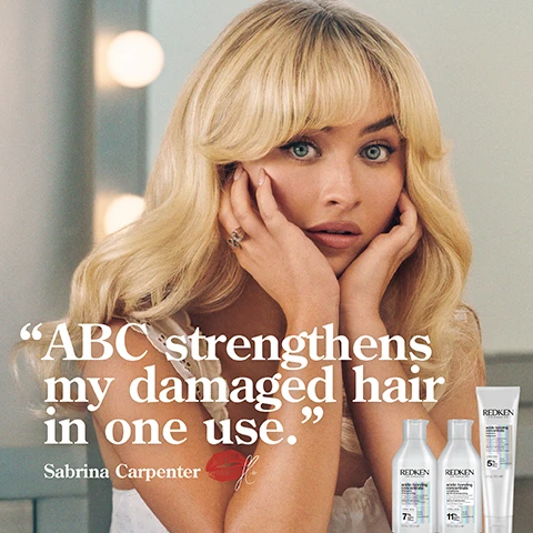 Image 1 - A woman with long, blonde hair and a surprised expression rests her chin on her hands, and the image features hair care products labeled REDKEN, along with the text ABC strengthens my damaged hair in one use. Sabrina Carpenter.
Image 2 - A bottle of Redken Acidic Bonding Concentrate Shampoo is shown with foam around it, accompanied by text stating 56% less breakage, 11 times smoother, and silky finish & glossy shine.
Image 3 - A partially-opened bottle of hair conditioner with a creamy product visible inside, featuring text that states 56% less breakage*, 90% more conditioned*, and 11X smoother**.
Image 4 - A person holds a tube of Redken hair product, highlighting benefits such as up to 11 times smoother hair, 78% less visible split ends, and heat protection up to 230°C.
Image 5 - A close-up image shows a smooth, white creamy texture with bubbles alongside a thicker white substance, featuring text that reads Citric Acid + Bonding Care Complex Helps Repair Bonds + Prevent Future Damage.
Image 6 - The image shows two side-by-side comparisons of hair: the left side labeled BEFORE displays uneven, frizzy hair, while the right side labeled AFTER ONE USE* shows smooth, sleek hair; the text at the bottom notes SYSTEM OF ACIDIC BONDING CONCENTRATE INTENSIVE TREATMENT, SHAMPOO, CONDITIONER & LEAVE-IN VS. UNDAMAGED HAIR.
Image 7 - A person with curly hair is shown from the back, with a visibly frizzy texture on the left side labeled BEFORE and smoother, more defined curls on the right side labeled AFTER ONE USE, along with a note about the hair treatment products used.
Image 8 - A hand holds a bottle of Redken Acidic Bonding Concentrate shampoo against a light background, with five stars above and a quote stating BEST I’VE EVER USED AND I’M A HAIRDRESSER, along with a note about receiving the product from Marie Claire Beauty Drawer, Aug 2022.
Image 9 - A tube of Redkens Acidic Bonding Concentrate leave-in treatment is displayed against a light background, accompanied by five black stars and text reading THE BEST LEAVE-IN TREATMENT I HAVE EVER USED MY HAIR LOOKS BETTER & BETTER AFTER EACH USE. At the bottom, a note states RECEIVED THE PRODUCT TO TRY FROM MARIE CLAIRE BEAUTY DRAWER, NOV 2021.
Image 10 - A hand holds a small amount of a creamy hair product from a tube labeled Redken, with a photo of a woman and the text that says LOVED BY PROS and the quote WORKS LIKE MAGIC! THE LEAVE-IN TREATMENT WILL PROTECT AND NOURISH YOUR HAIR WITHOUT IT FEELING HEAVY OR GREASY - PROTECTS AGAINST HEAT TOO! by Lorna Valente, hairstylist at Percy & Reed Salon