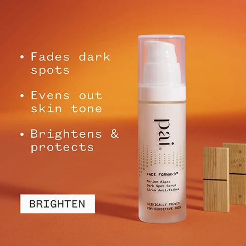 Image 1 - A bottle of Pai Fade Forward dark spot serum is shown against an orange background with text that states it fades dark spots, evens out skin tone, brightens and protects, and includes the words BRIGHTEN and CLINICALLY PROVEN FOR SENSITIVE SKIN.
Image 2 - A hand holds a bottle of skincare serum labeled as Fade Forward, with the visible text stating 82% agreed it visibly reduced the appearance of dark spots, and additional certification icons for vegan and organic standards.