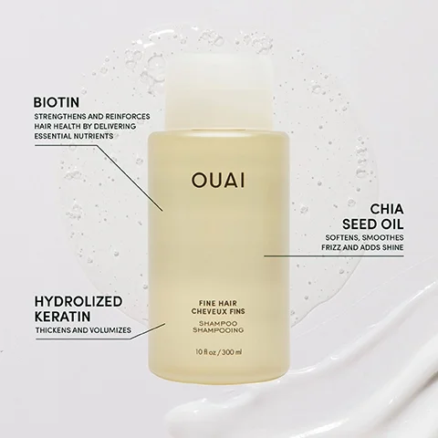 A bottle of OUAI shampoo for fine hair is shown with highlights of key ingredients: Biotin, which strengthens hair health, Chia Seed Oil, which softens and adds shine, and Hydrolyzed Keratin, which thickens and volumizes, alongside visible text describing the product size of 10 fl oz or 300 ml.