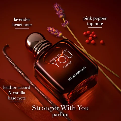 Image 1 - A dark amber perfume bottle labeled Stronger With You parfum sits on a brown surface surrounded by lavender and pink pepper, with text indicating lavender as the heart note, pink pepper as the top note, and leather accord and vanilla as the base notes.