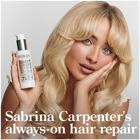 Image 1 - A woman with long blonde hair holds a bottle of hair repair product and smiles, with the text Sabrina Carpenters always-on hair repair prominently displayed below.
Image 10 - A person with curly hair holds a pump bottle in one hand while dispensing product into their other hand, and the image features text that reads START WITH 2 PUMPS, ADD MORE AS NEEDED REAPPLY NIGHT AND DAY AS DESIRED.
Image 11 - A split image shows a person with curly hair on the left applying product to their hair, and the same person on the right with defined curls, with visible text that reads APPLY TO MID-LENGTHS & ENDS ON DAMP OR DRY HAIR.
Image 12 - Image features two bottles of Redken hair products, with one labeled acidy bonding concentrate shampoo and the other acidy bonding concentrate conditioner, accompanied by a five-star rating and the text BEST I’VE EVER USED AND I’M A HAIRDRESSER, along with a note about receiving the product from Marie Claire Beauty Drawer, August 2022.
Image 13 - A tube of Redken leave-in treatment is displayed with five black stars above it and text that reads THE BEST LEAVE-IN TREATMENT I HAVE EVER USED and MY HAIR LOOKS BETTER & BETTER AFTER EACH USE with a footnote stating *RECEIVED THE PRODUCT TO TRY FROM MARIE CLAIRE BEAUTY DRAWER, NOV 2021.
Image 2 - A bottle of Redken Acidic Bonding Concentrate Shampoo is surrounded by white foam, with text stating Silky Finish & Glossy Shine, 56% Less Breakage*, and 11x Smoother**, against a simple black background.
Image 3 - A close-up of a shampoo bottle with a flipped open cap revealing a small amount of product, featuring text that states 56% less breakage*, 90% more conditioned*, and 11x smoother**.
Image 4 - A person is holding a small amount of cream in their hand with a tube of Redken product beside them, and the image features text stating UP TO 11X SMOOTHER HAIR*, 78% LESS VISIBLE SPLIT ENDS**, and HEAT PROTECTION UP TO 230°C.
Image 5 - A bottle of Redken 24/7 Bond Repair Overnight Treatment is displayed on a gradient background; visible text includes 24/7 BOND REPAIR OVERNIGHT TREATMENT, UP TO 89% LESS BREAKAGE*, UP TO 3X SOFTER*, and additional product information.
Image 6 - Image split into two sections showing hair before and after treatment: the left side shows frizzy, uneven blonde hair labeled BEFORE, and the right side displays smooth, straight, and shiny blonde hair labeled AFTER ONE USE* with text at the bottom reading SYSTEM OF ACIDIC BONDING CONCENTRATE INTENSIVE TREATMENT SHAMPOO, CONDITIONER & LEAVE-IN VS. UNDAMAGED HAIR.
Image 7 - Image shows a side-by-side comparison of a womans hair: on the left, her curly hair appears frizzy with loose curls labeled BEFORE, and on the right, the curls are defined and shiny labeled AFTER*. The text at the bottom reads AFTER ACIDIC BONDING CONCENTRATE SHAMPOO, CONDITIONER AND 24/7 SERUM.
Image 8 - An image featuring several textured white substances with visible text stating CITRIC ACID + BONDING CARE COMPLEX HELPS REPAIR BONDS + PREVENT FUTURE DAMAGE.
Image 9 - Image shows a sleek graphic with a light background and a stylized wireframe shape, featuring bold black text that reads: CITRIC ACID PENETRATES 7 LAYERS DEEP & STRENGTHENS HAIR* followed by smaller text: *CONTINUED USE OF SYSTEM OF ABC SHAMPOO, CONDITIONER, AND SERUM VS. UNTREATED HAIR.