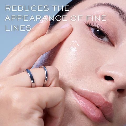 Image 1 - A person is applying a clear skincare product to their cheek while wearing two silver rings, with the text REDUCES THE APPEARANCE OF FINE LINES visible in the background.
Image 2 - A close-up of a man gently touching his cheek, highlighting his clear skin, with the text 85% AGREE OVERALL APPEARANCE OF SKIN IS IMPROVED* and *Consumer Study with 34 women in the bottom corner.
Image 3 - A close-up image of a woman applying a skincare product to her cheek, smiling, with the text 88% AGREE SKIN APPEARS SMOOTHER* and *Consumer Study with 34 women.
Image 4 - Three close-up portraits of diverse women applying skincare products, with the text SKIN REGENERATES FASTER, EVEN AS YOU AGE at the top and the phrases TARGETS APPEARANCE OF DARK SPOTS*, FACE AND NECK FEEL LIFTED*, and WRINKLES APPEAR REDUCED* displayed prominently.