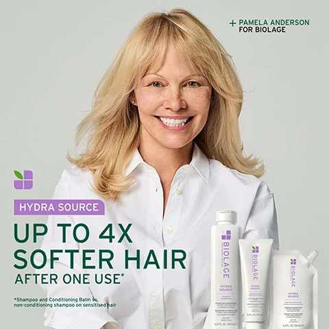 Image 2 - Pamela Anderson, a blonde woman, smiles at the camera, wearing a white shirt, with three white Biolage Hydra Source hair products in front of her, and text reading + PAMELA ANDERSON FOR BIOLAGE, HYDRA SOURCE, UP TO 4X SOFTER HAIR AFTER ONE USE*, *Shampoo and Conditioning Balm vs. non-conditioning shampoo on sensitised hair, Biolage Hydra Source Shampoo 13.5 FL. OZ. 400 ml, Biolage Hydra Source Conditioning Balm 8.0 FL. OZ. 236 ml, and Biolage Hydra Source Deep Treatment Mask 3.3 FL. OZ. 100 ml. Image 3 - The image displays two Biolage Hydra Source shampoo bottles, comparing old and new packaging, with text OLD, NEW, and UPGRADED PACKAGING AND FORMULA; the old bottle is white with a purple cap, showing PROFESSIONAL BIOLAGE HYDRA SOURCE shampoo shampooing FOR DRY HAIR infused with aloe POUR CHEVEUX SECS infusé à laloe vera VEGAN FORMULA Cruelty Free INTERNATIONAL 95% recycled cap RECYCLED BOTTLE* 8.4 FL. OZ. / 250 ml e; and the new bottle is white with a white cap, showing PROFESSIONAL HAIR SPA BIOLAGE HYDRA SOURCE SHAMPOO SHAMPOOING HYDRATION CONCENTRATE with aloe + hyaluronic acid 6 micrograms per 100 ml CONCENTRÉ DHYDRATATION à laloès + acide hyaluronique 6 microgrammes par 100 ml DRY HAIR CHEVEUX SECS 13.5 FL. OZ. 400 ml e. Image 4 - A persons hand combs through wet, highlighted hair, with clear product visible on the comb, next to text that reads UP TO 4X SOFTER HAIR AFTER ONE USE. followed by the footnote Hydra Source Shampoo & Conditioning Balm vs. non-conditioning shampoo on sensitised hair. Image 5 - The image is a before and after comparison of reddish-brown hair, with the left side showing straighter, less defined hair and the right side showing the same hair with more defined waves and shine; the text reads BEFORE / AFTER and below the image, *After one use of Hydra Source Shampoo & Conditioning Balm. Image 6 - A close-up of an aloe vera leaf with a clear droplet of liquid on it against a green background, with the text Formulated with Aloe Vera To help nourish hair, promoting lasting feeling of hydration. Image 7 - A split image showing a clear, viscous, light green liquid with bubbles and reflections on the right, and text on a dark green background on the left next to a logo with a green leaf in purple squares, which reads: MICRO-DOSED HYDRATION CONCENTRATE, 6 micrograms per 100 ml, Aloe Vera, Hyaluronic acid. Image 8 - An image with a dark green background displays product information in white text: IS IT FOR ME? HYDRA SOURCE. BEST FOR Dry hair. Suitable for colour-treated hair. HAIR TYPE Fine to medium. KEY BENEFITS Nourishes, smoothes, leaves hair looking hydrated. A small white leaf icon is at the bottom. Image 9 - Two white Biolage Hydra Source hair product bottles, one shampoo and one conditioner, stand on a green shelf against a green background, with text above them reading 01 Cleanse and 02 Condition, and the left bottle reads Biolage PROFESSIONAL HAIR SPA HYDRA SOURCE SHAMPOO SHAMPOOING HYDRATION CONCENTRATE with aloe + hyaluronic acid 6 micrograms per 100ml CONCENTRÉ DHYDRATATION à laloès + acide hyaluronique 6 microgrammes par 100ml DRY HAIR CHEVEUX SECS 13.5 FL. OZ. 400 ml e and the right bottle reads Biolage PROFESSIONAL HAIR SPA HYDRA SOURCE CONDITIONING BALM BAUME REVITALISANT HYDRATION CONCENTRATE with aloe 81 micrograms per 100 ml CONCENTRÉ DHYDRATATION à laloès 81 microgrammes par 100 ml DRY HAIR CHEVEUX SECS 8.0 FL. OZ. 236 ml e. Image 10 - A close-up of a clear liquid dropper with a large drop forming against a dark green background. Text reads: FORMULATED WITH HYALURONIC ACID To help seal in the appearance of cuticles to leave hair feeling weightlessly conditioned and looking hydrated.
